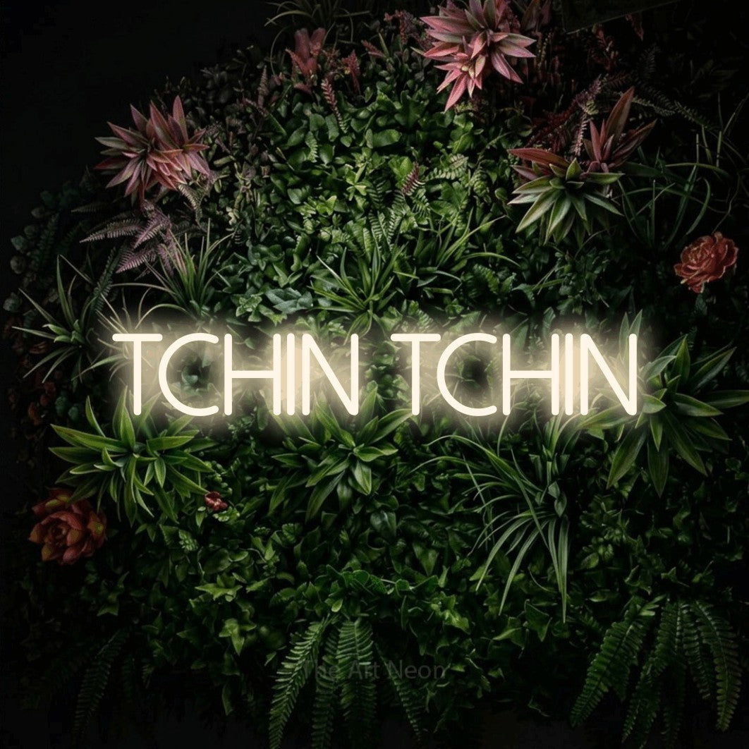 LED neon sign reading “TCHIN TCHIN”, arranged in a single line.