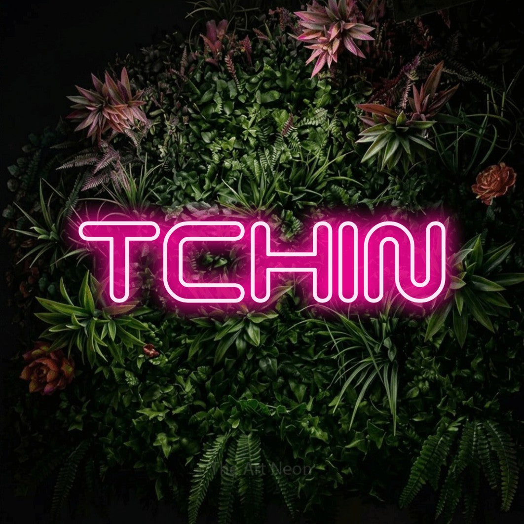 LED neon sign reading “TCHIN”, arranged in a single line.