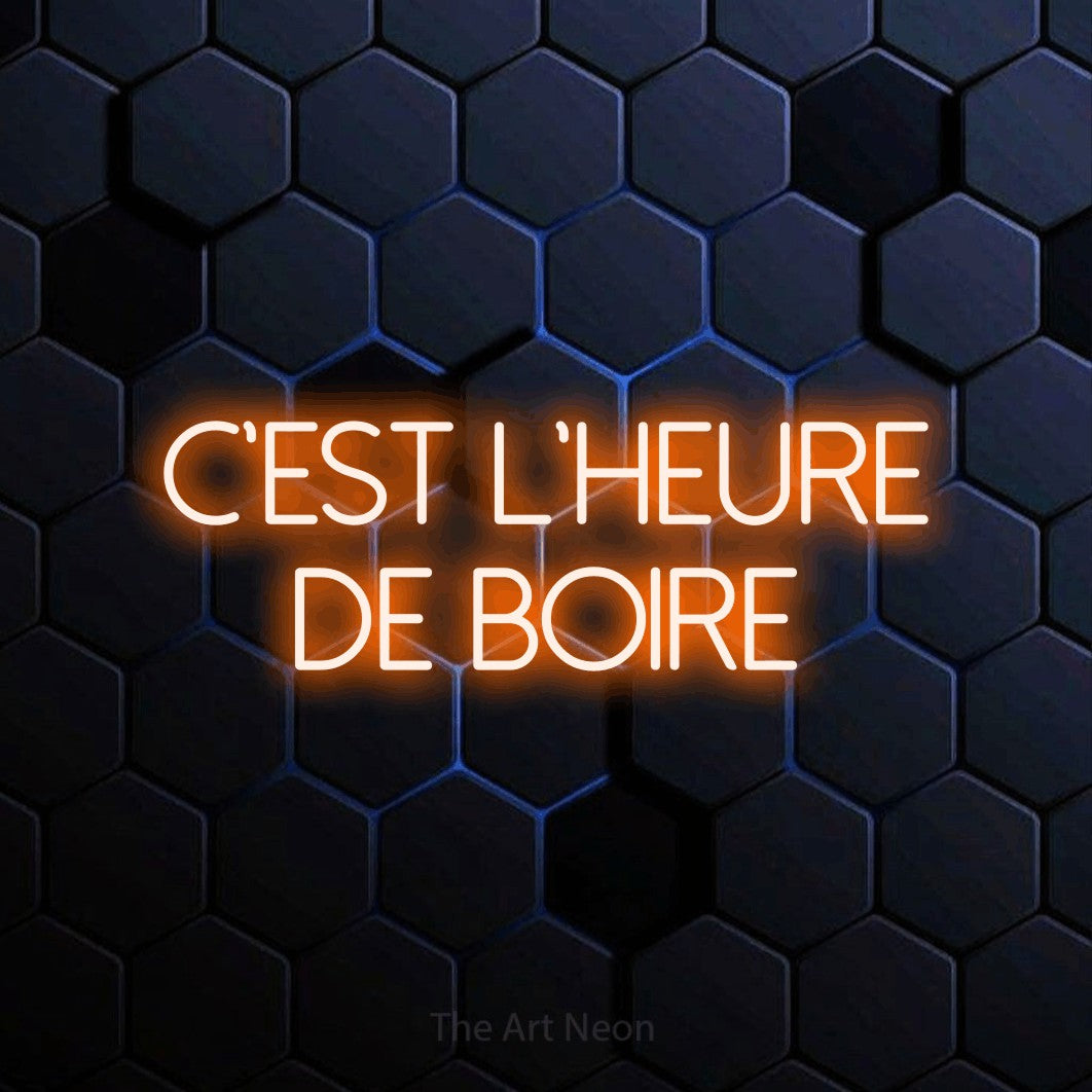 LED neon sign reading “C'est l'heure de boire”, arranged in 2 lines.