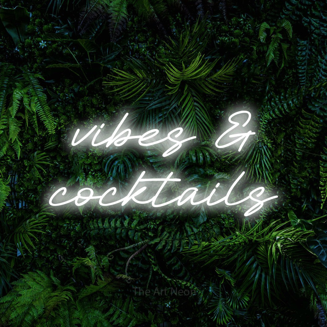 LED neon sign reading “vibes & cocktails”, arranged in 2 lines.