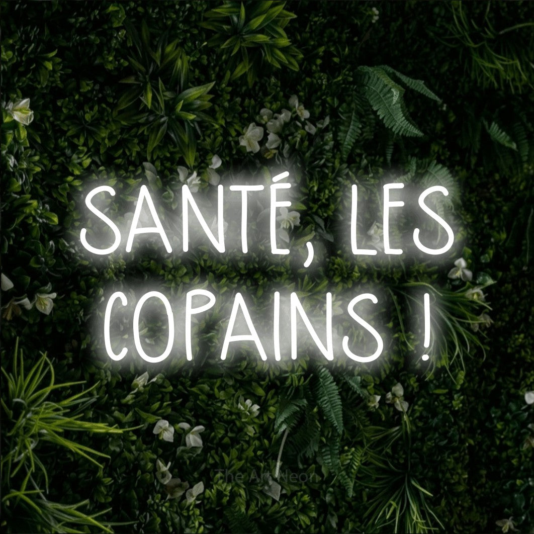 LED neon sign reading “SANTÉ, LES COPAINS !”, arranged in 2 lines.