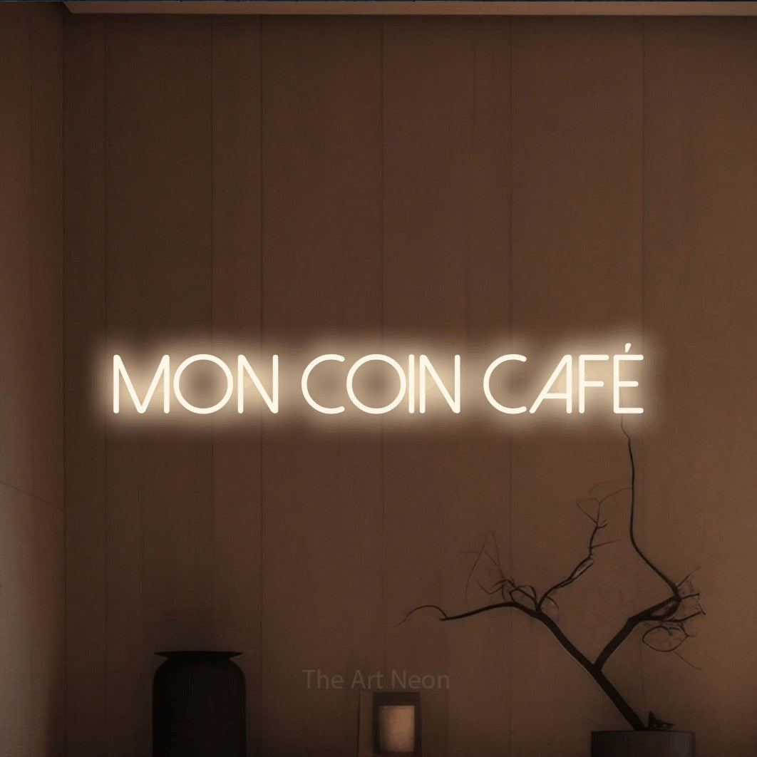 LED neon sign reading “Mon Coin Café”, arranged in a single line.