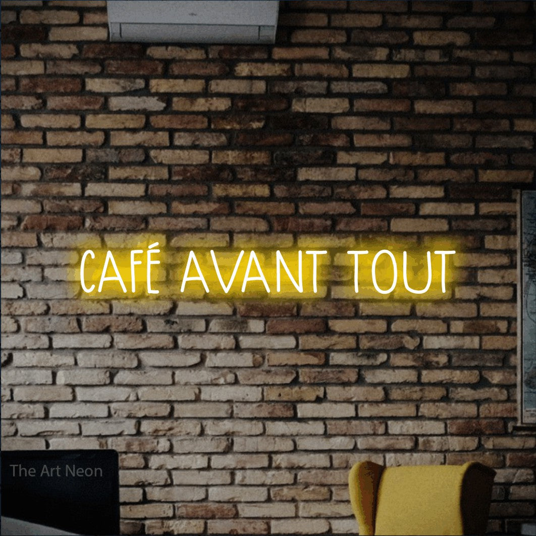 LED neon sign reading “CAFÉ AVANT TOUT”, arranged in a single line.
