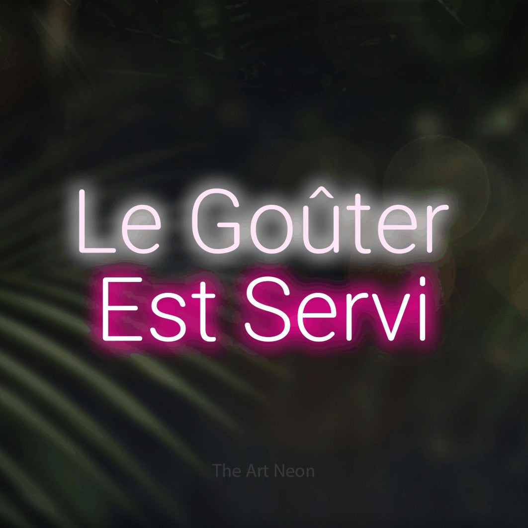 LED neon sign reading “Le Goûter Est Servi”, arranged in 2 lines.
