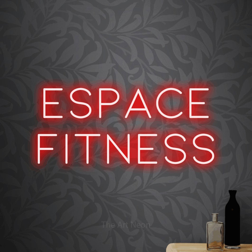 LED neon sign reading “espace fitness”, arranged in 2 lines.