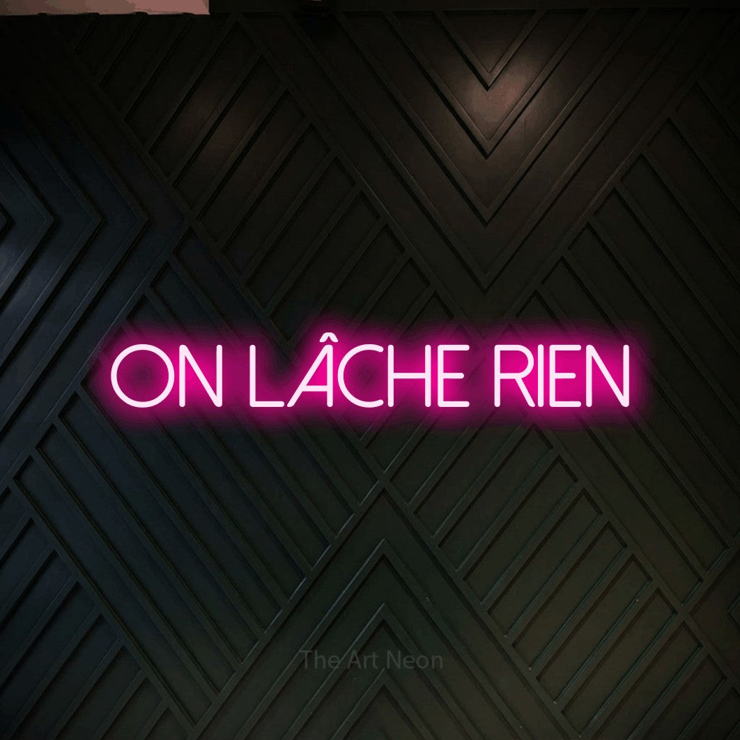 LED neon sign reading “On Lâche Rien”, arranged in a single line.