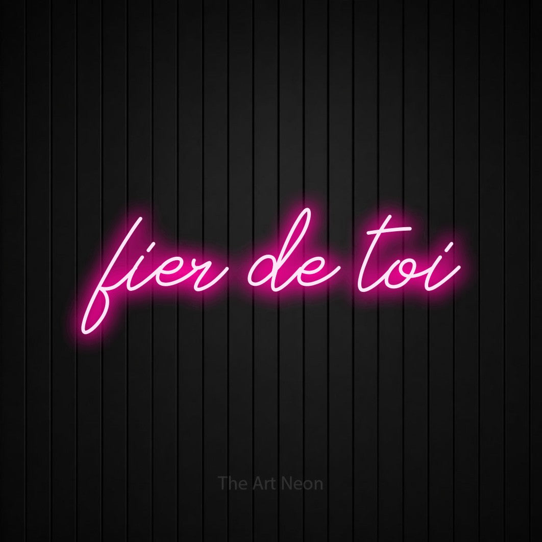 LED neon sign reading “fier de toi”, arranged in a single line.