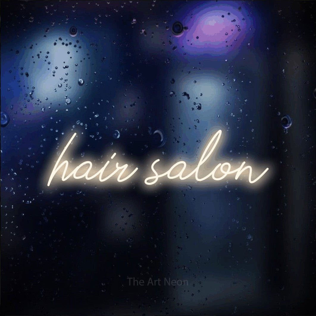 LED neon sign reading “hair salon”, arranged in a single line.