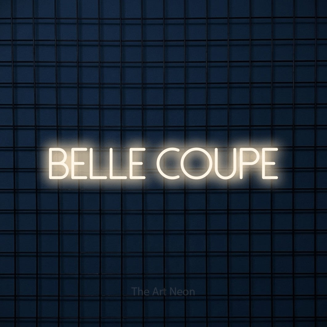 LED neon sign reading “Belle Coupe”, arranged in a single line.