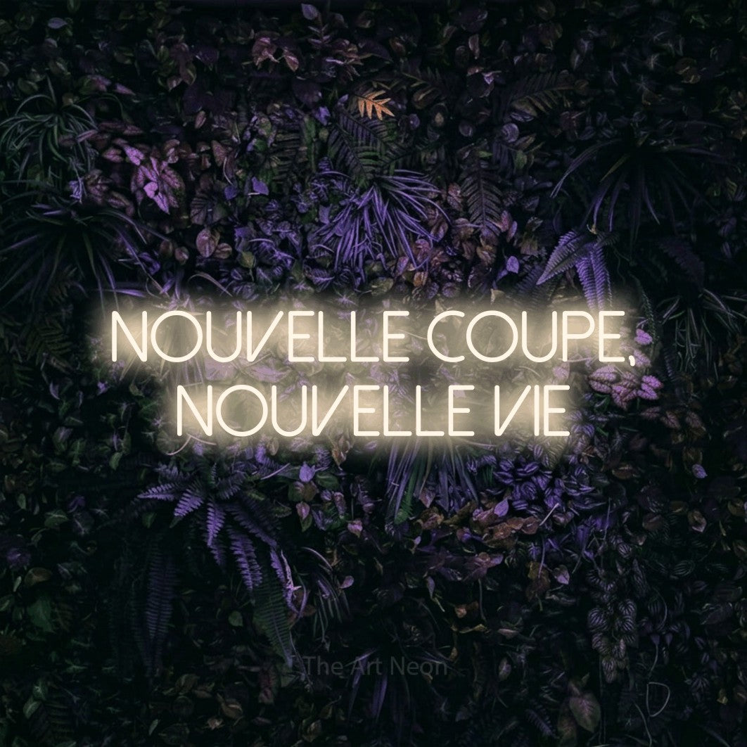 LED neon sign reading “NOUVELLE COUPE, NOUVELLE VIE”, arranged in 2 lines.