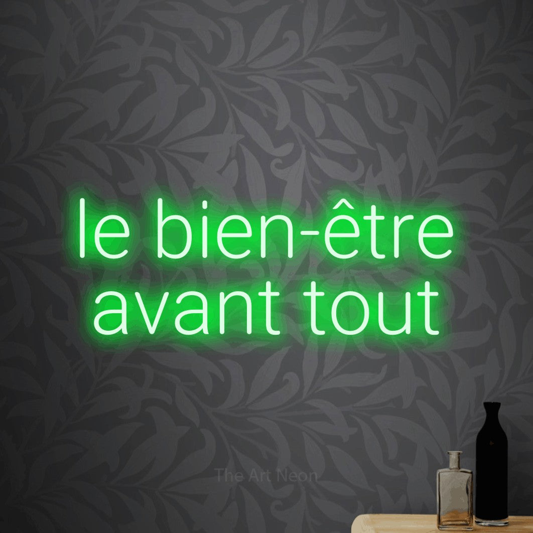 LED neon sign reading “le bien-être avant tout”, arranged in 2 lines.