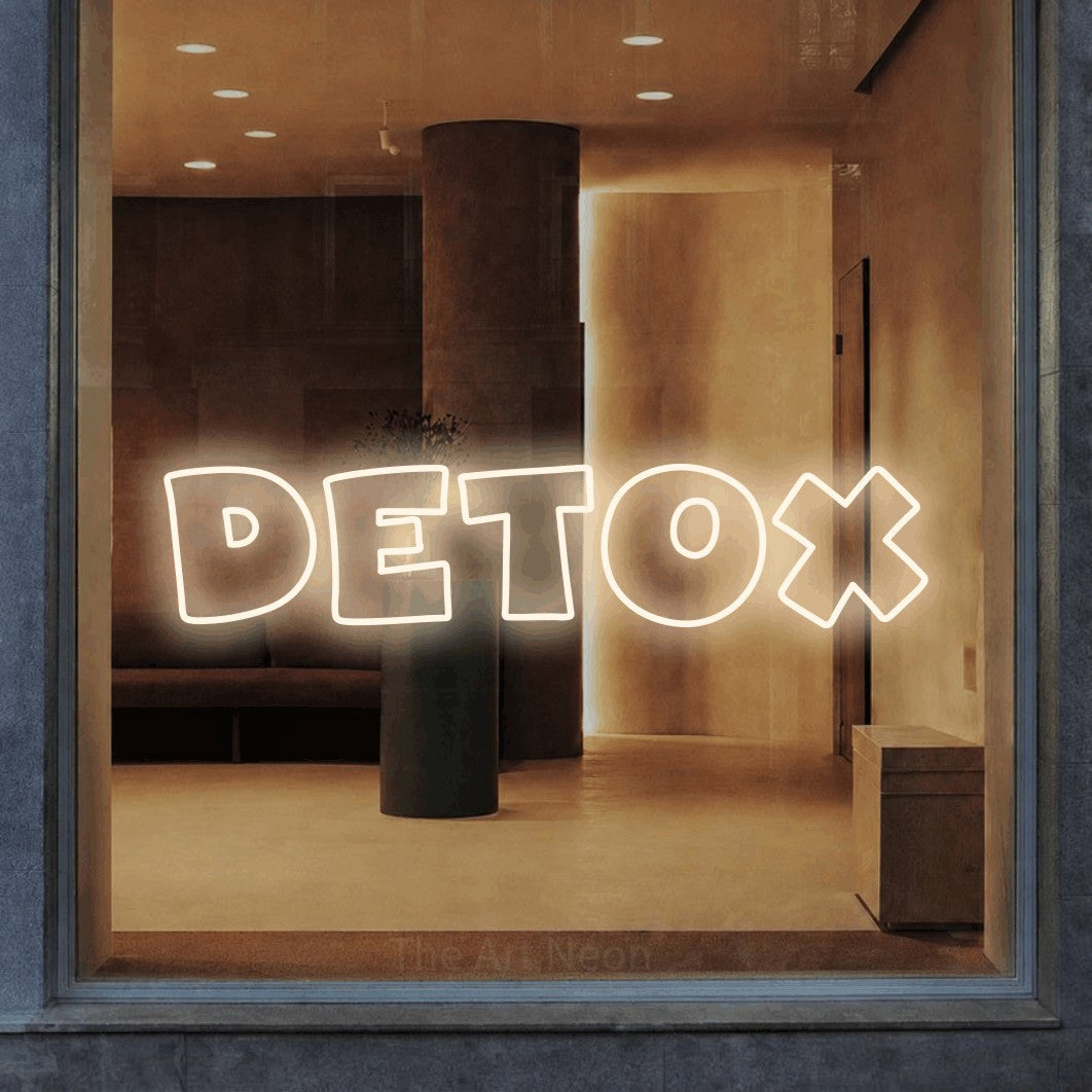 LED neon sign reading “Detox”, arranged in a single line.