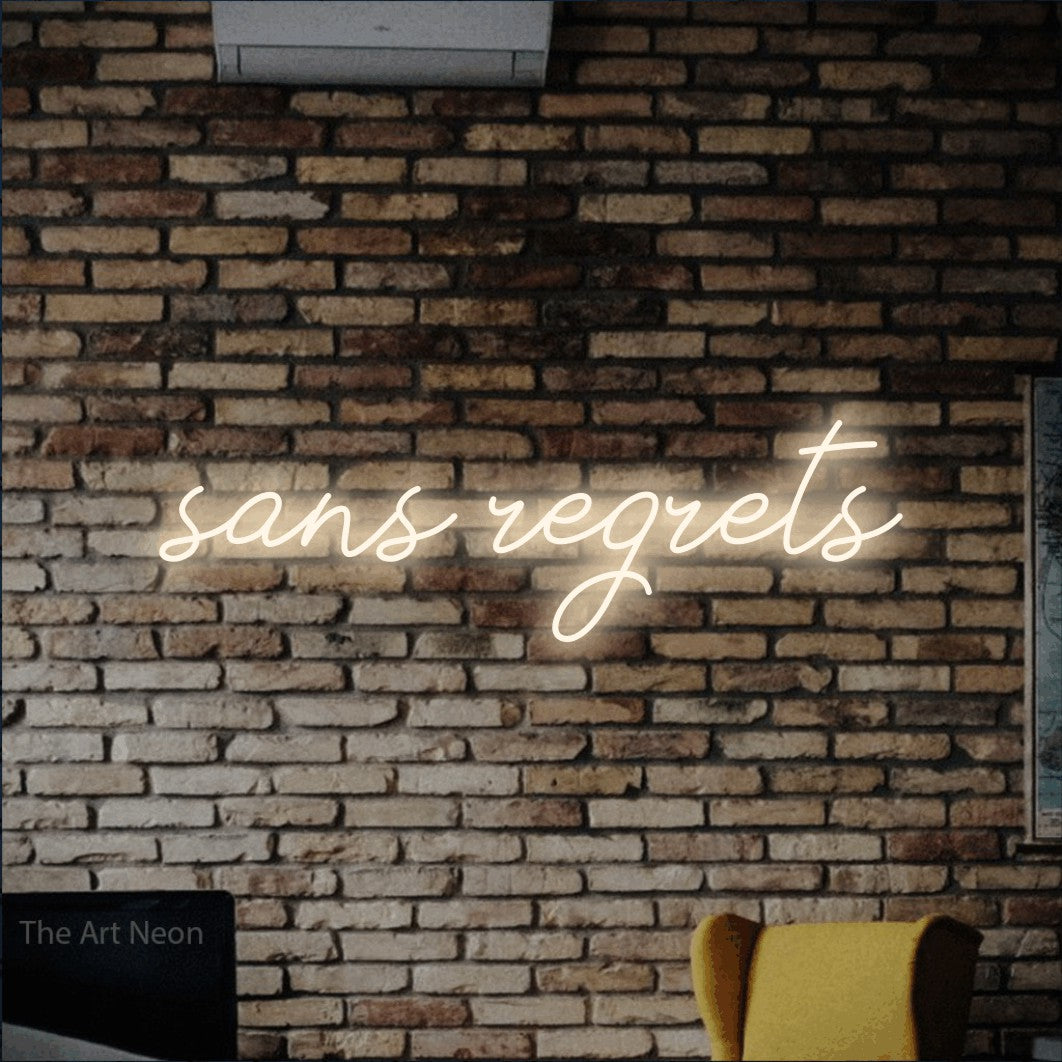 LED neon sign reading “sans regrets”, arranged in a single line.