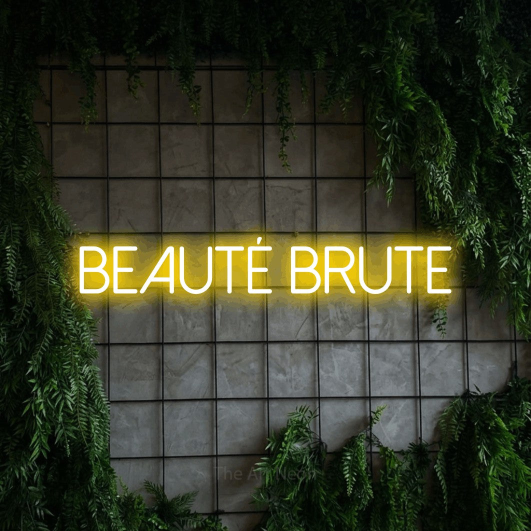 LED neon sign reading “beauté brute”, arranged in a single line.