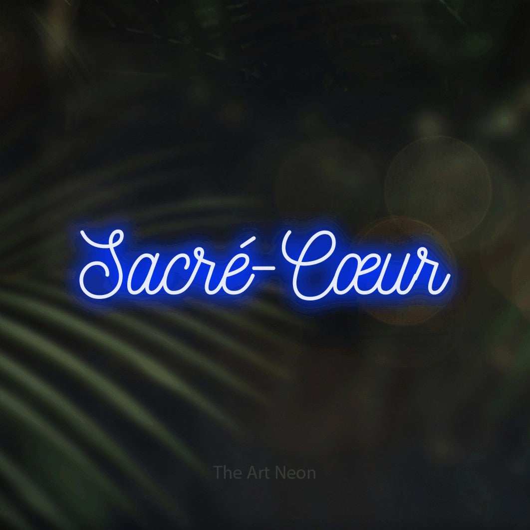 LED neon sign reading “Sacré-Cœur”, arranged in a single line.