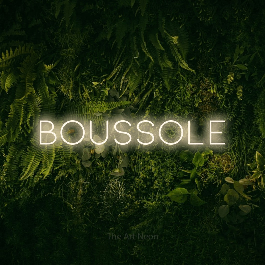 LED neon sign reading “BOUSSOLE”, arranged in a single line.