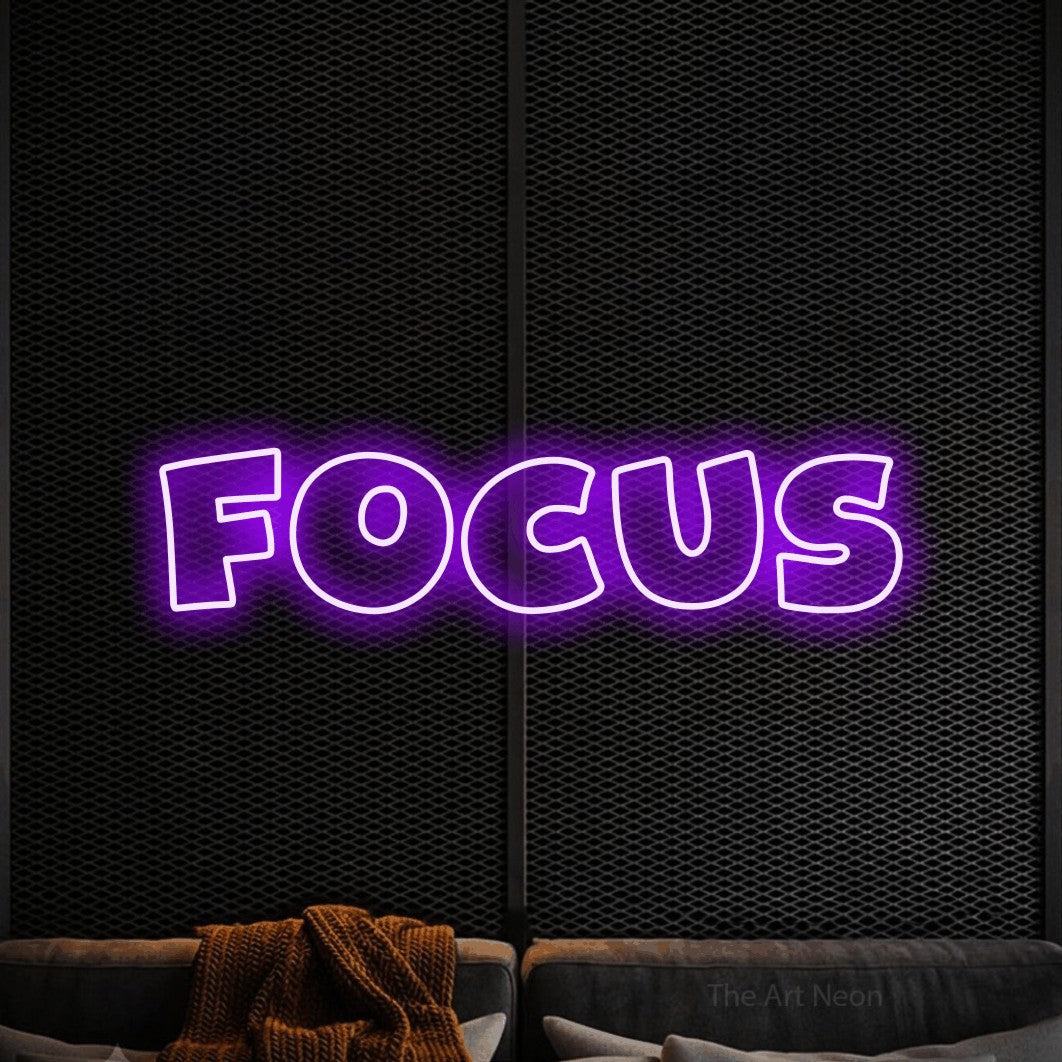 LED neon sign reading “FOCUS”, arranged in a single line.