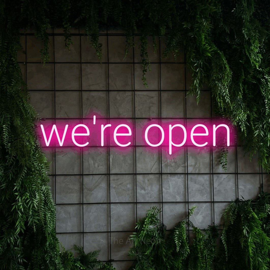 LED neon sign reading “we're open”, arranged in a single line.
