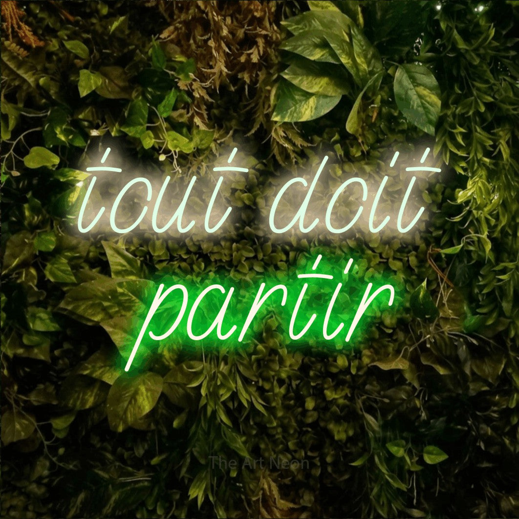 LED neon sign reading “tout doit partir”, arranged in 2 lines.