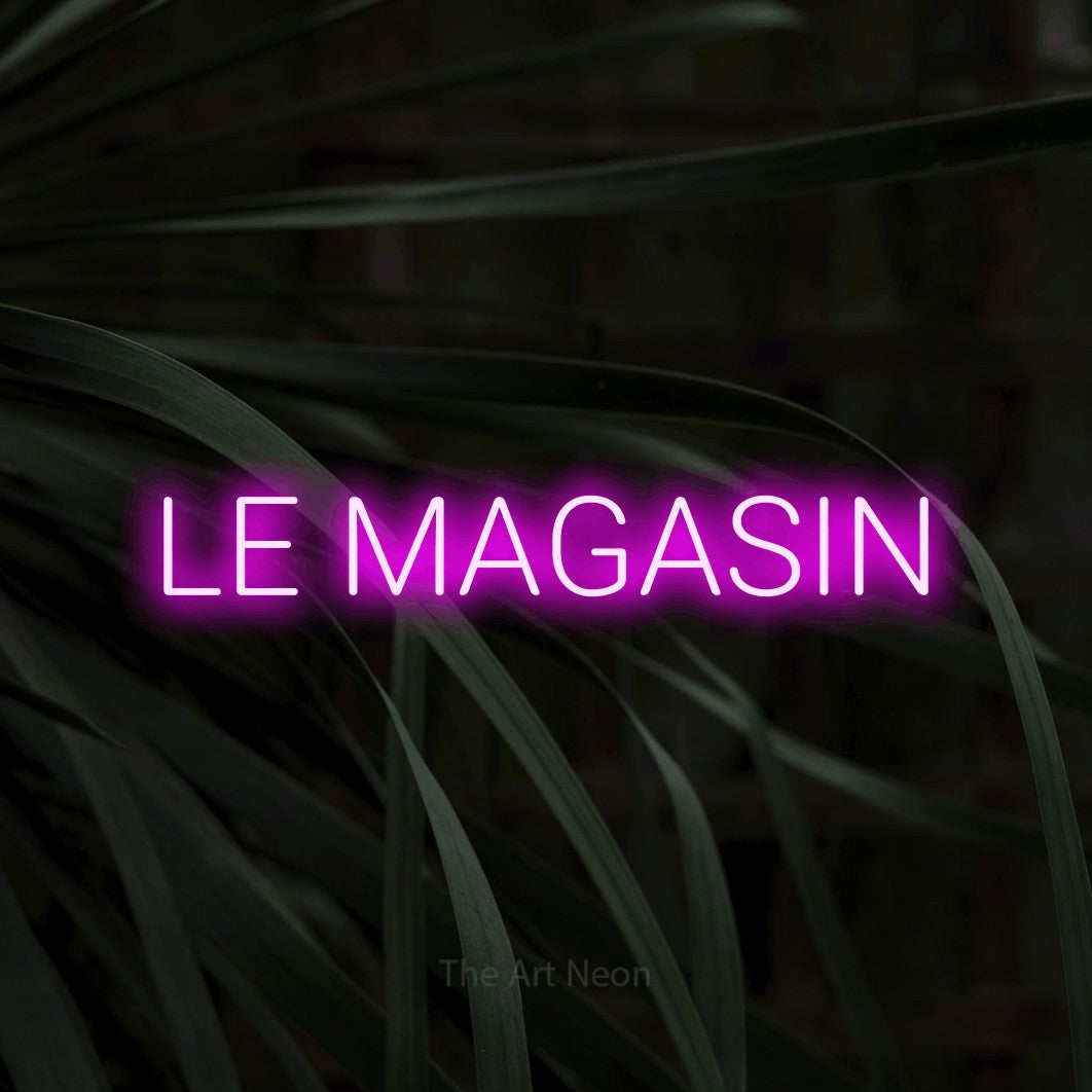 LED neon sign reading “LE MAGASIN”, arranged in a single line.