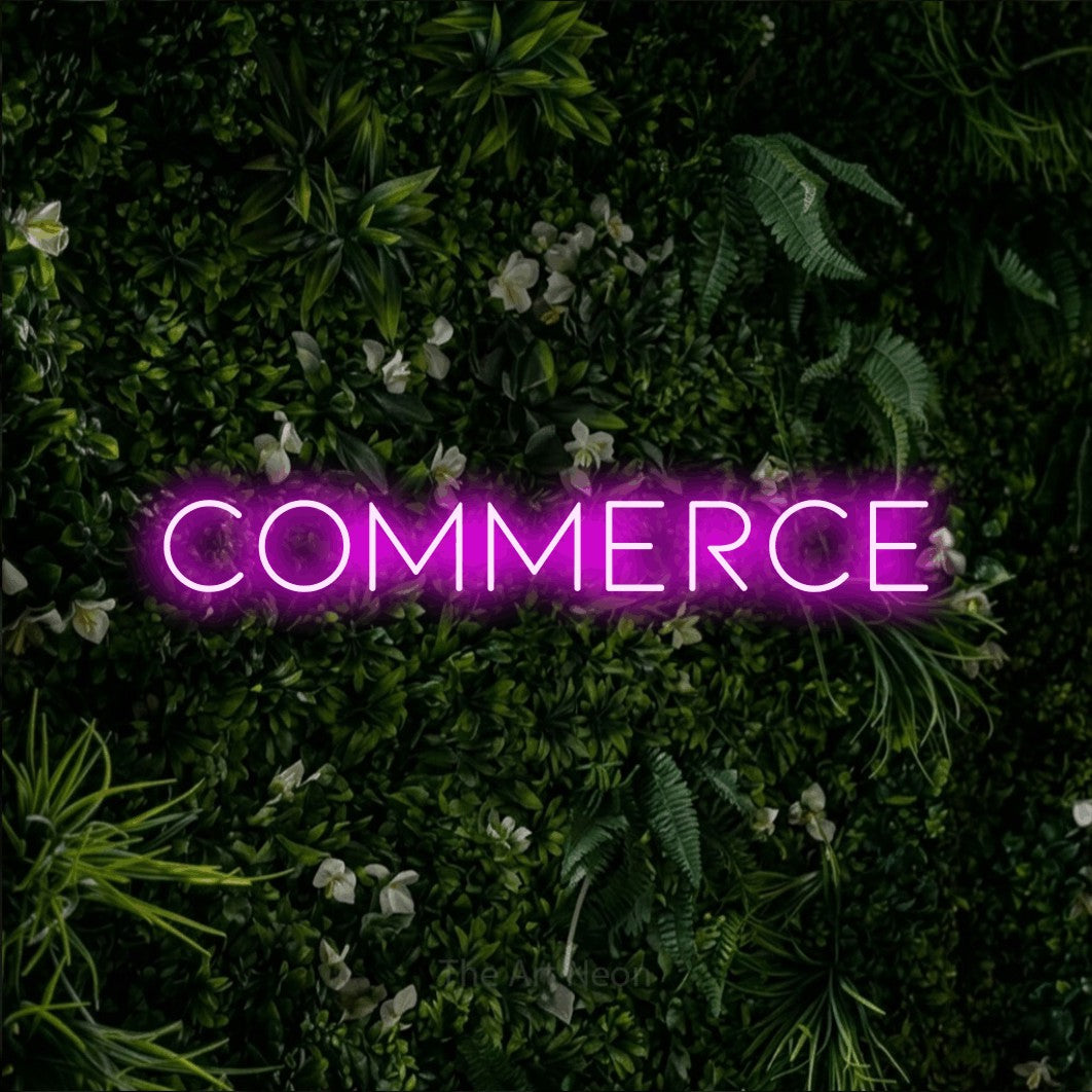 LED neon sign reading “Commerce”, arranged in a single line.