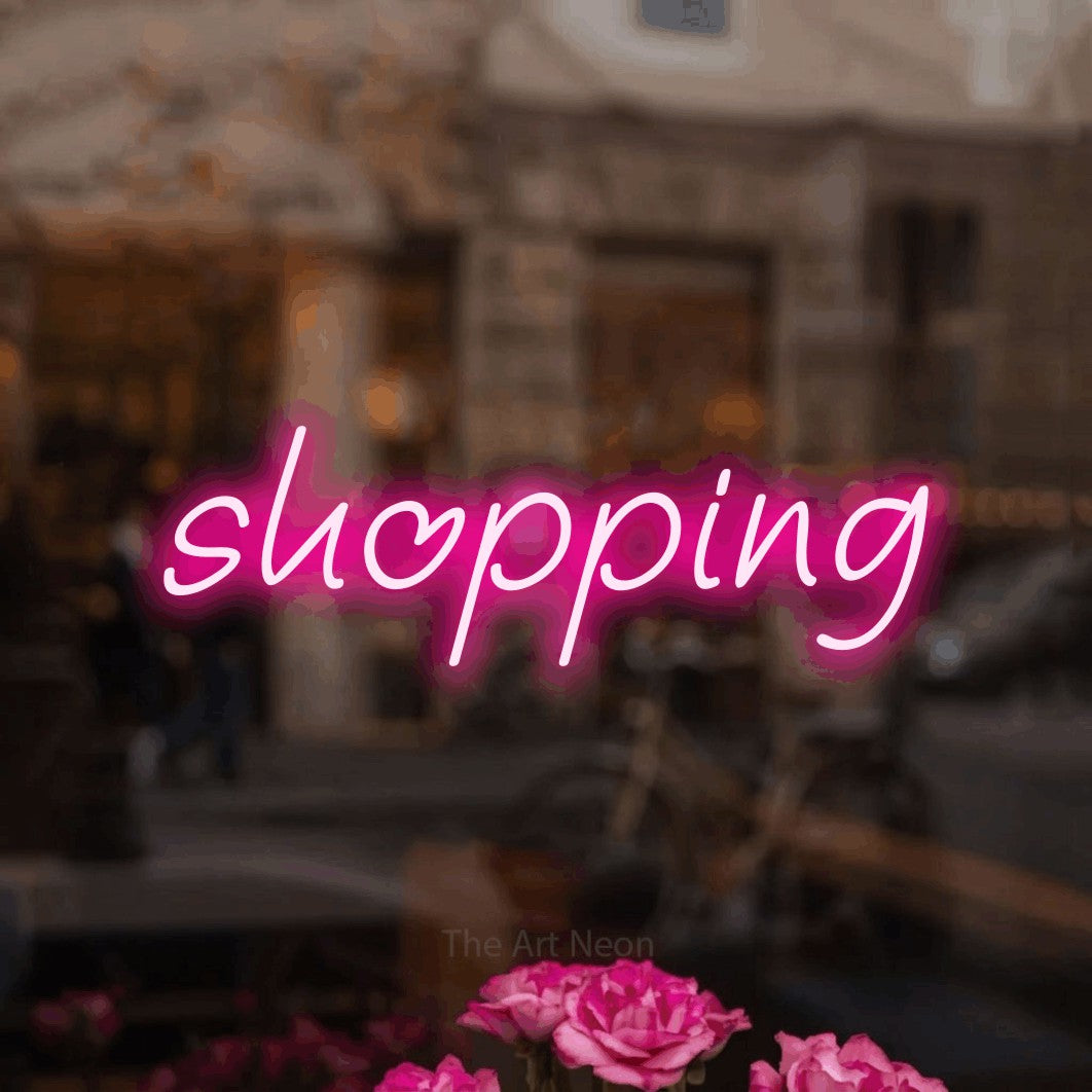 LED neon sign reading “shopping”, arranged in a single line.