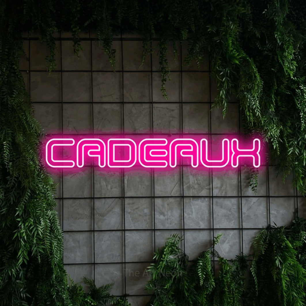 LED neon sign reading “CADEAUX”, arranged in a single line.
