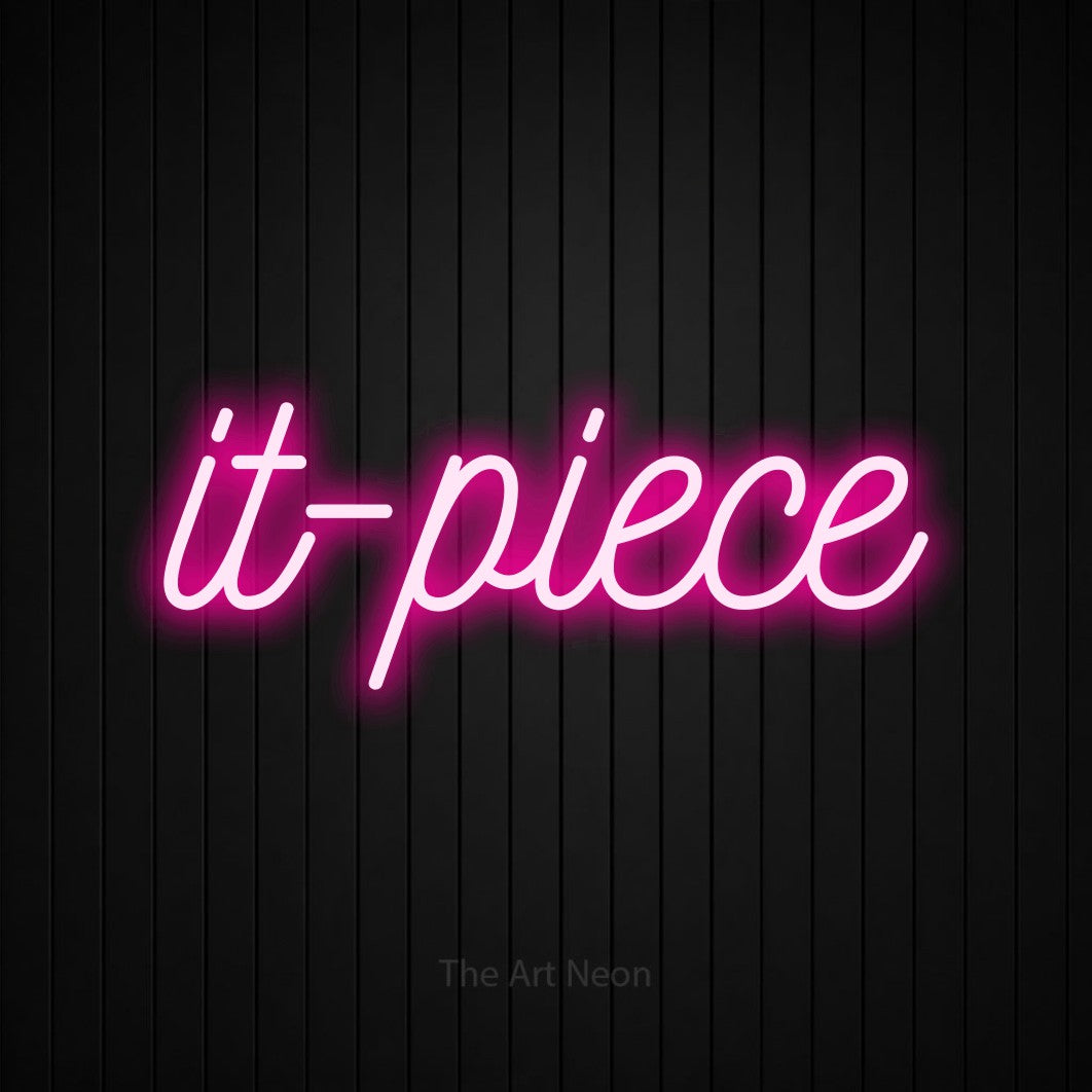 LED neon sign reading “it-piece”, arranged in a single line.