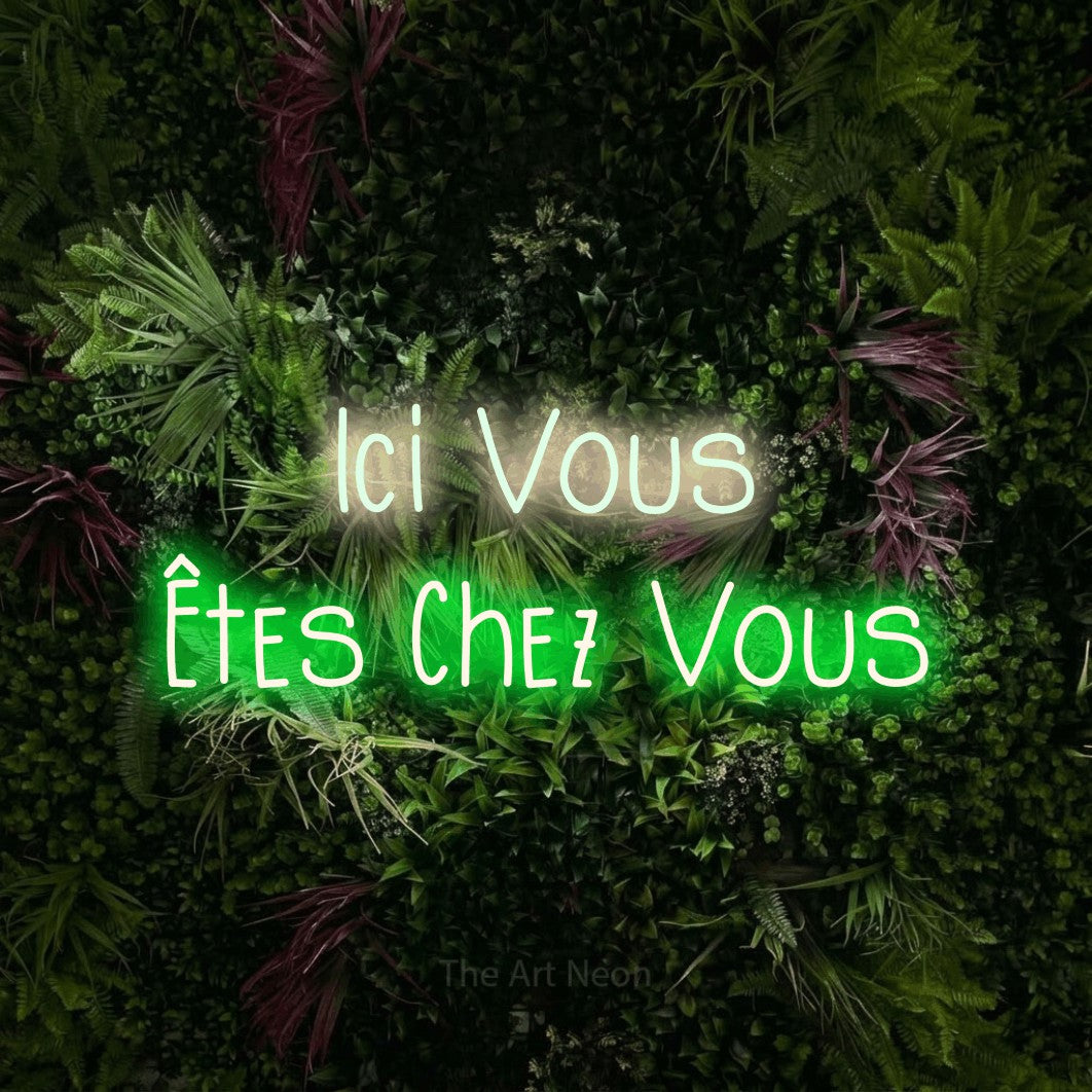 LED neon sign reading “Ici Vous Êtes Chez Vous”, arranged in 2 lines.