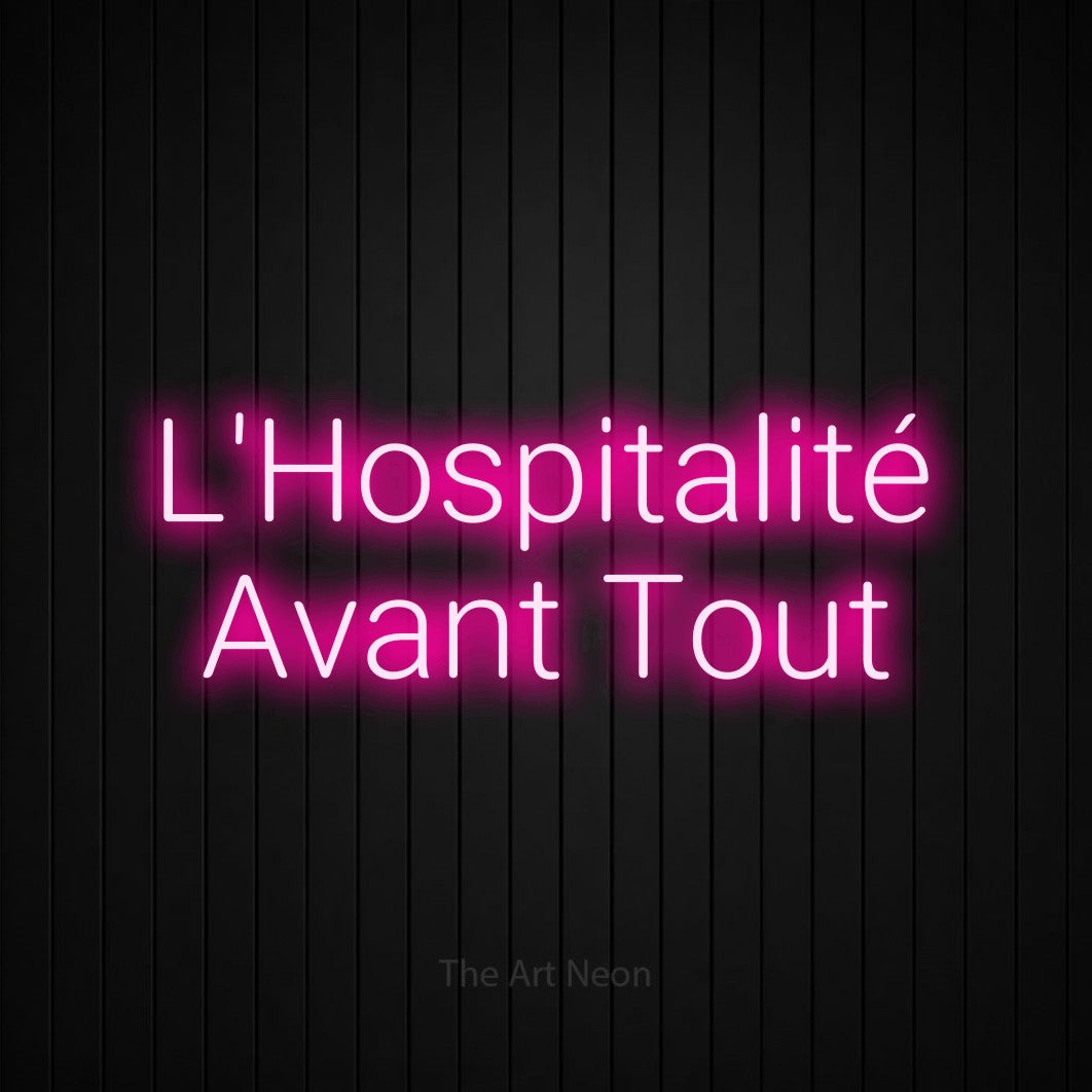 LED neon sign reading “L'Hospitalité Avant Tout”, arranged in 2 lines.