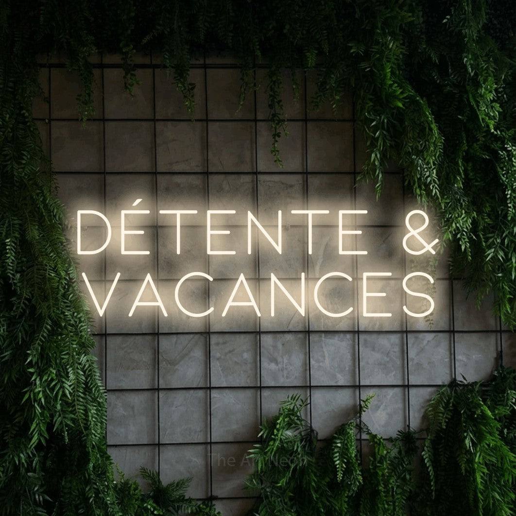 LED neon sign reading “DÉTENTE & VACANCES”, arranged in 2 lines.