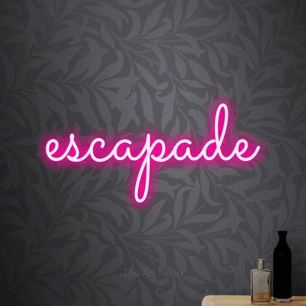LED neon sign reading “escapade”, arranged in a single line.