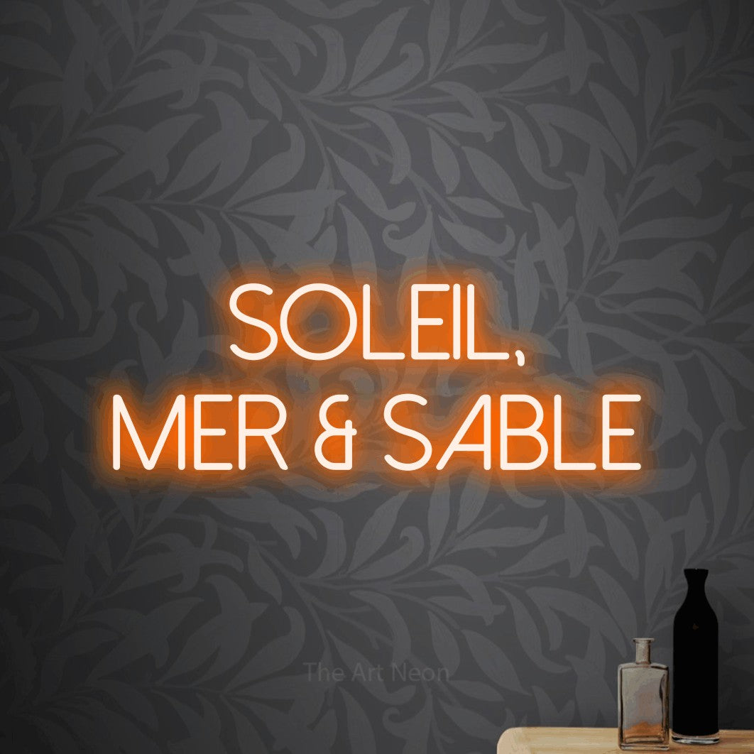LED neon sign reading “SOLEIL, mer & sable”, arranged in 2 lines.