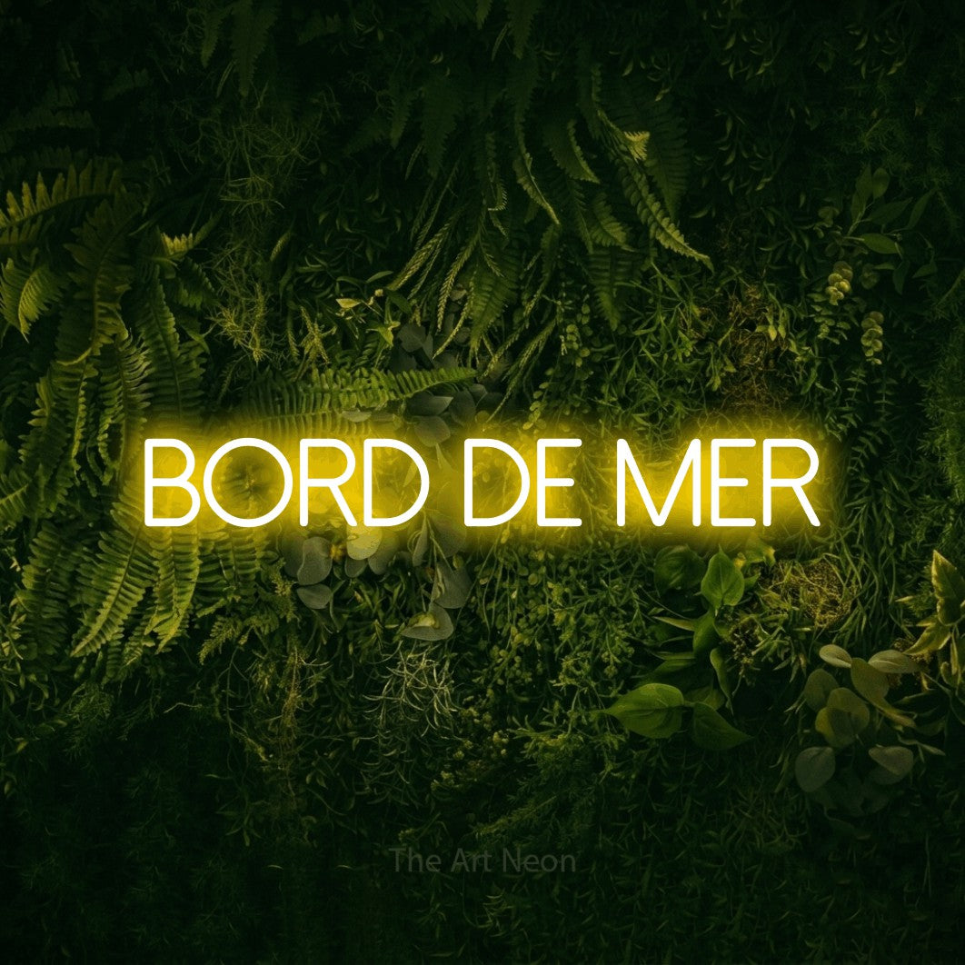 LED neon sign reading “Bord De Mer”, arranged in a single line.