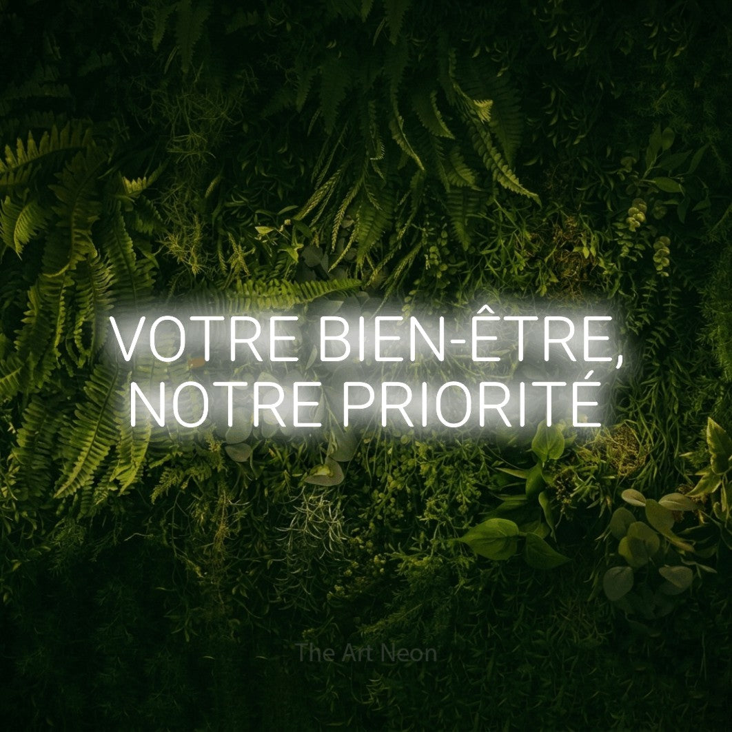 LED neon sign reading “VOTRE BIEN-ÊTRE, NOTRE PRIORITÉ”, arranged in 2 lines.