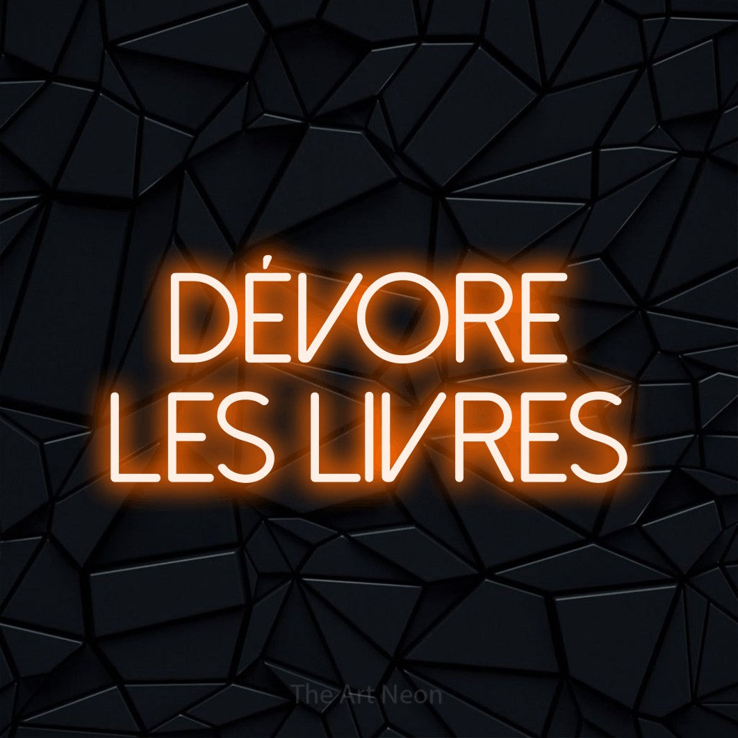 LED neon sign reading “Dévore Les Livres”, arranged in 2 lines.