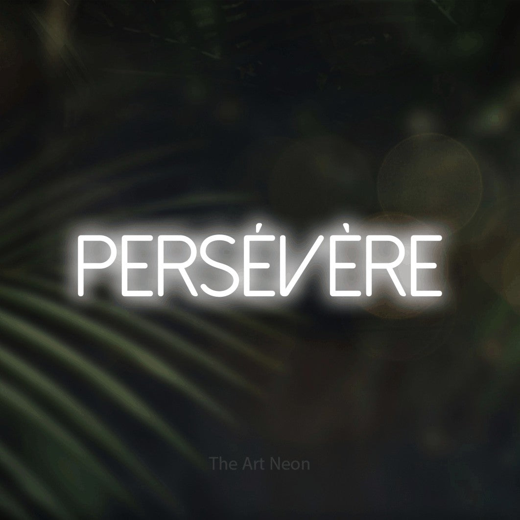 LED neon sign reading “PERSÉVÈRE”, arranged in a single line.