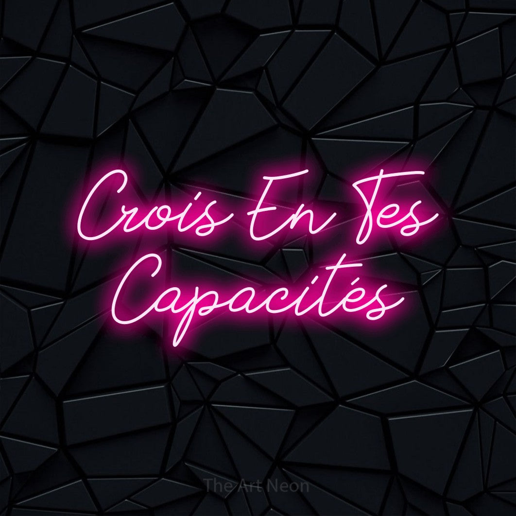 LED neon sign reading “Crois En Tes Capacités”, arranged in 2 lines.