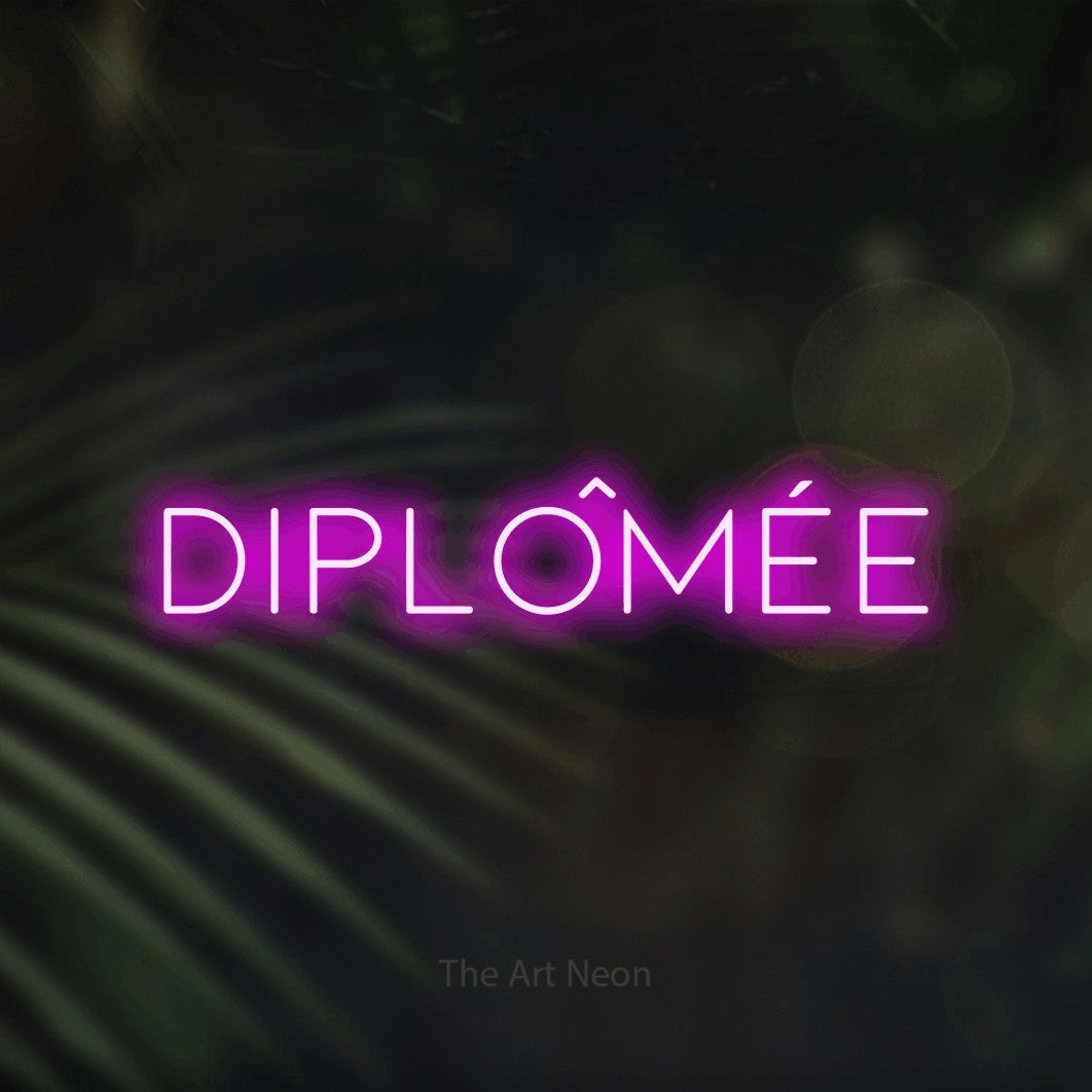 LED neon sign reading “Diplômée”, arranged in a single line.