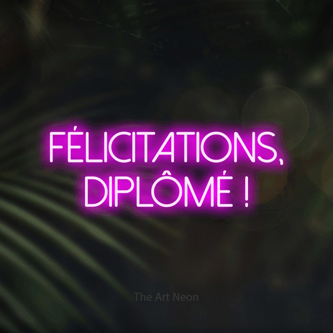 LED neon sign reading “félicitations, diplômé !”, arranged in 2 lines.