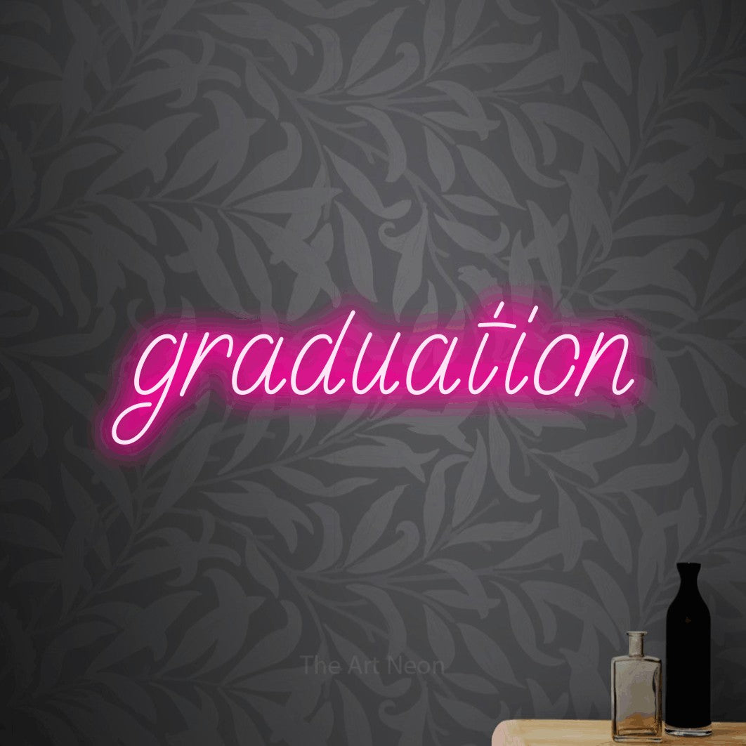 LED neon sign reading “graduation”, arranged in a single line.