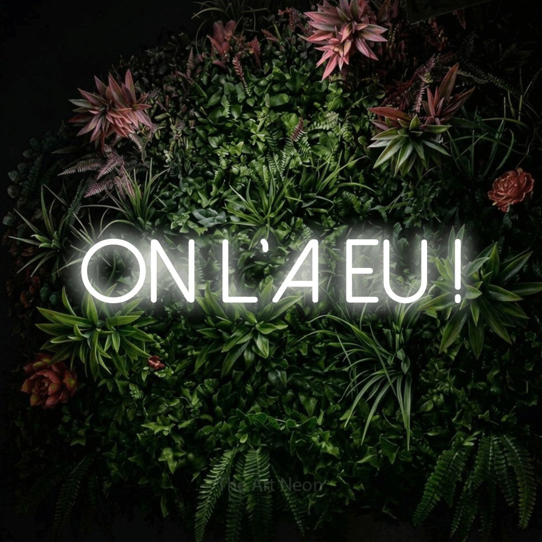 LED neon sign reading “ON L'A EU !”, arranged in a single line.