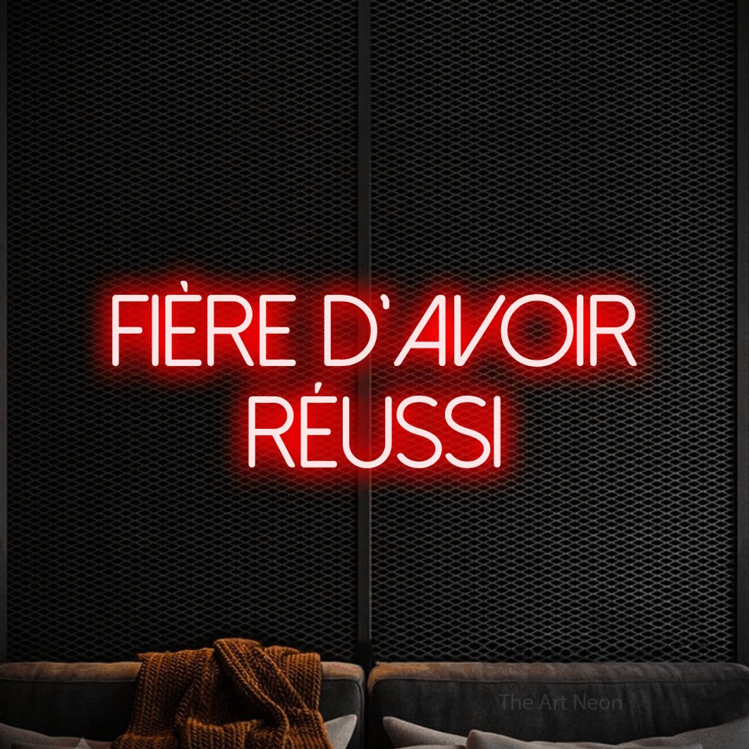 LED neon sign reading “Fière d'avoir réussi”, arranged in 2 lines.