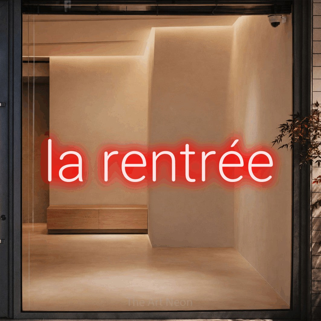LED neon sign reading “la rentrée”, arranged in a single line.