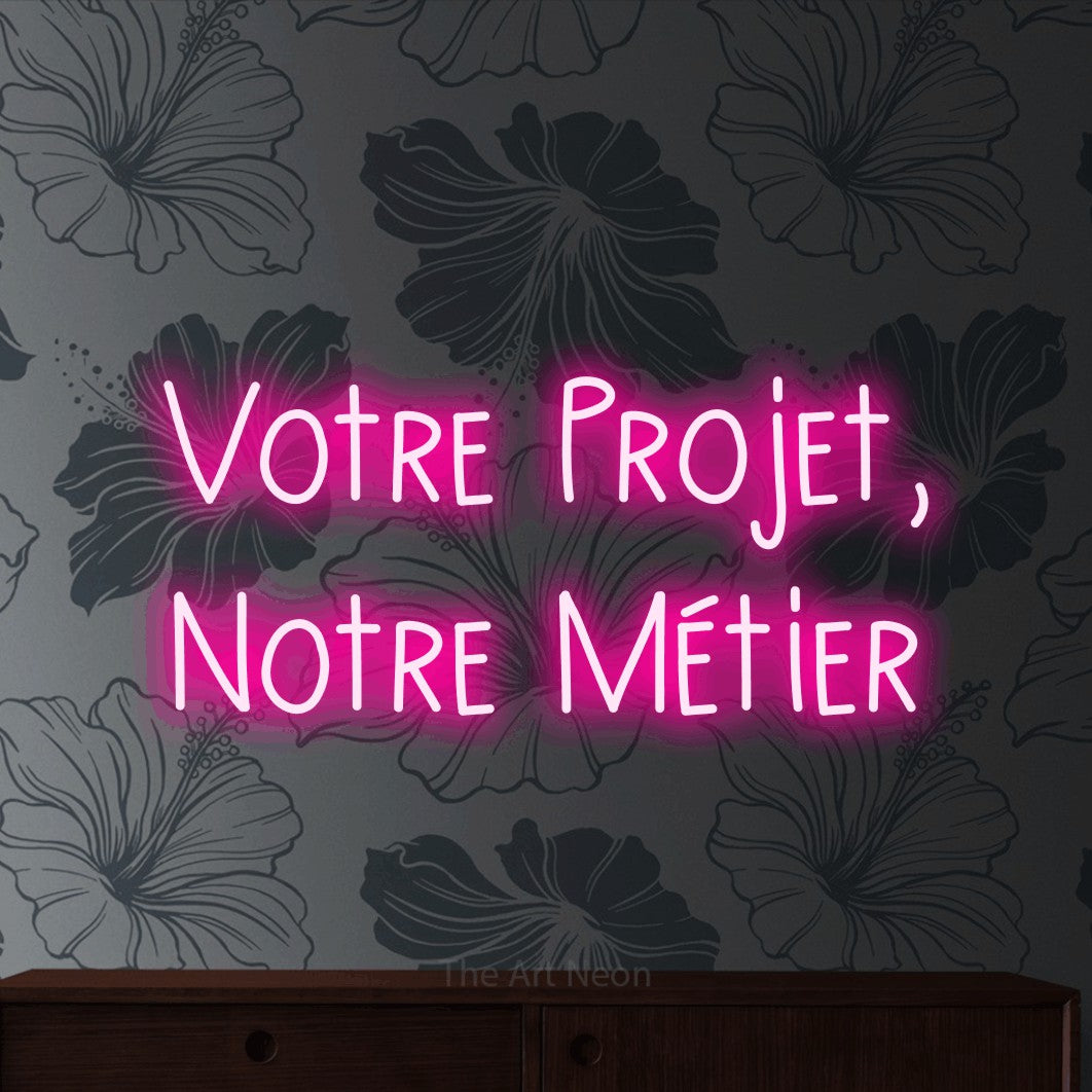 LED neon sign reading “Votre Projet, Notre Métier”, arranged in 2 lines.