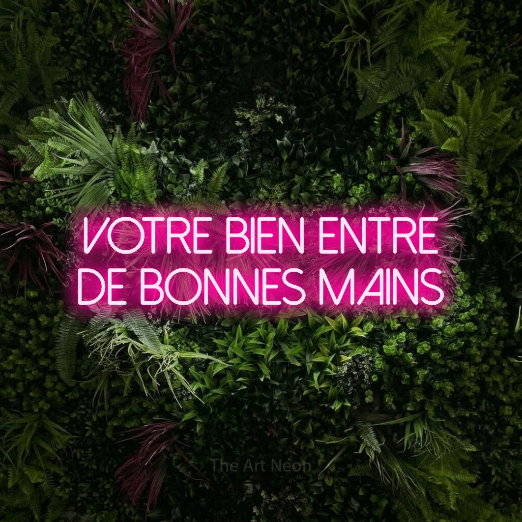 LED neon sign reading “VOTRE BIEN ENTRE DE BONNES MAINS”, arranged in 2 lines.