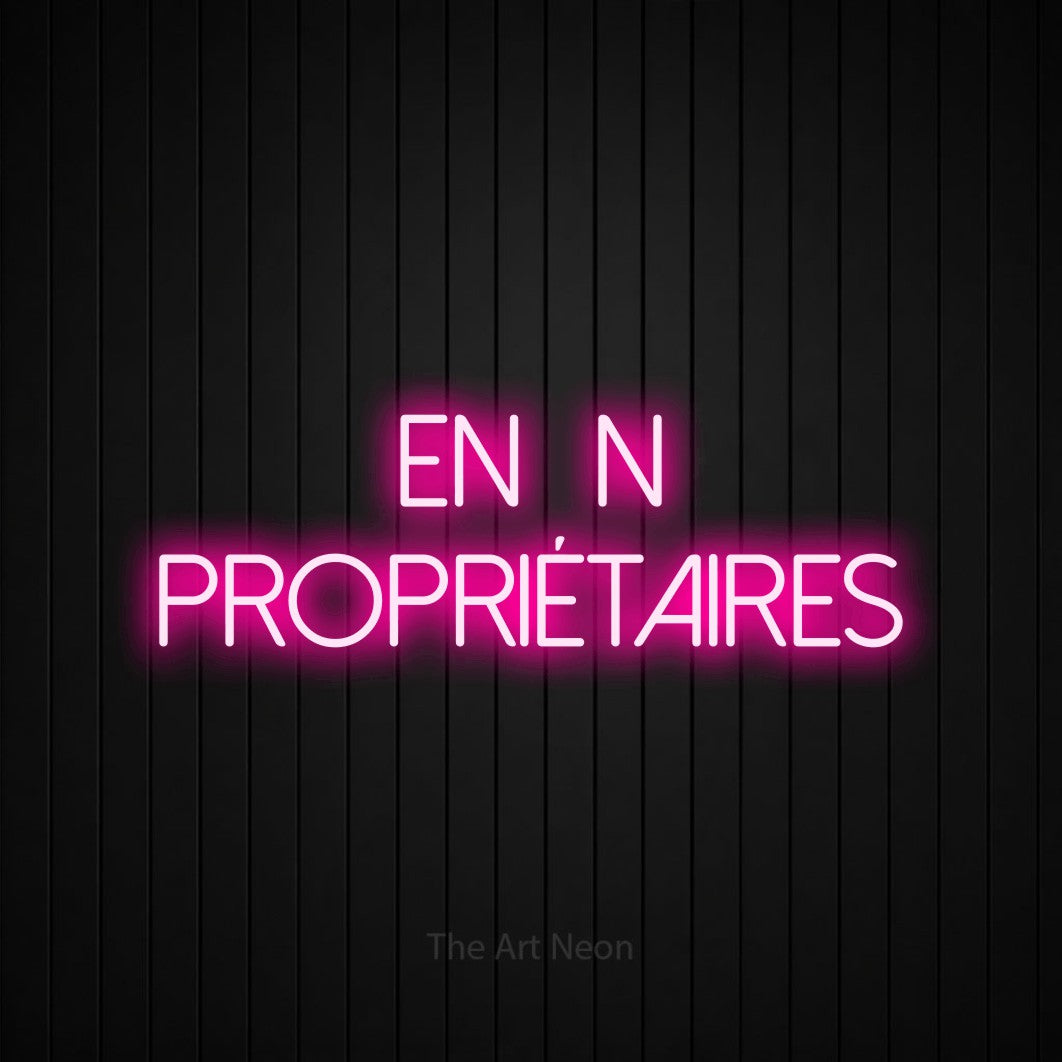 LED neon sign reading “enfin propriétaires”, arranged in 2 lines.