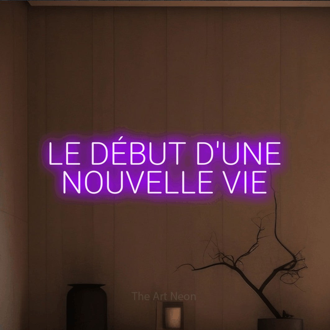 LED neon sign reading “LE DÉBUT D'UNE NOUVELLE VIE”, arranged in 2 lines.