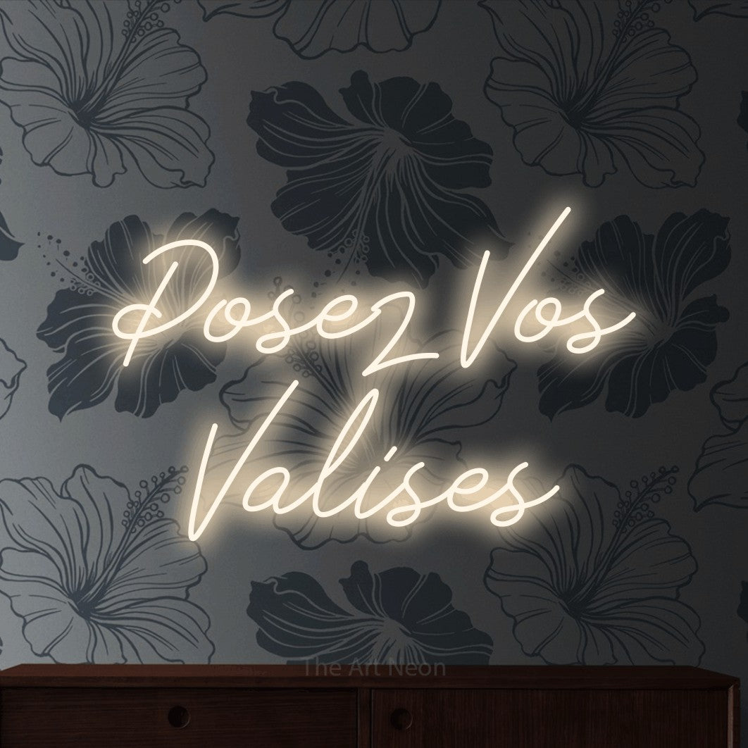 LED neon sign reading “Posez Vos Valises”, arranged in 2 lines.