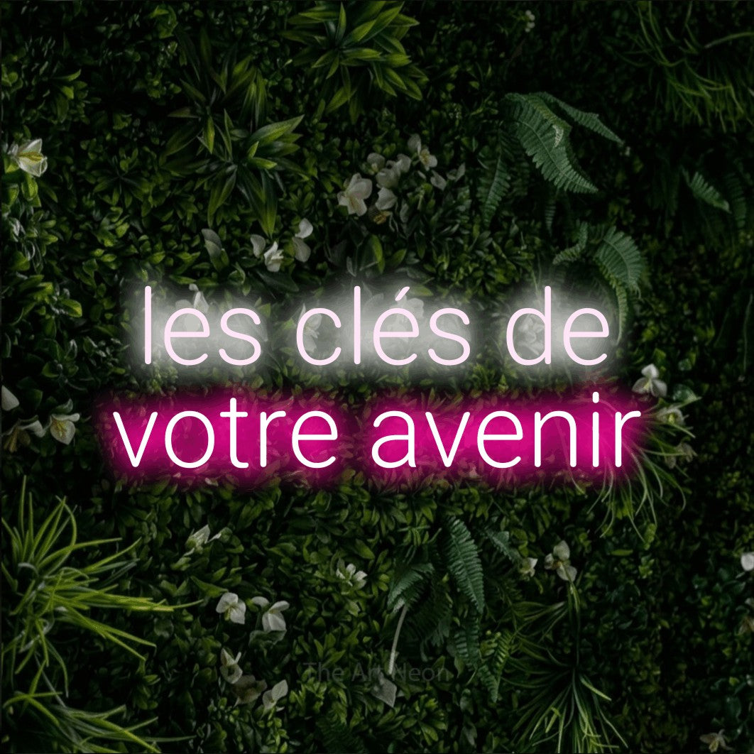 LED neon sign reading “les clés de votre avenir”, arranged in 2 lines.
